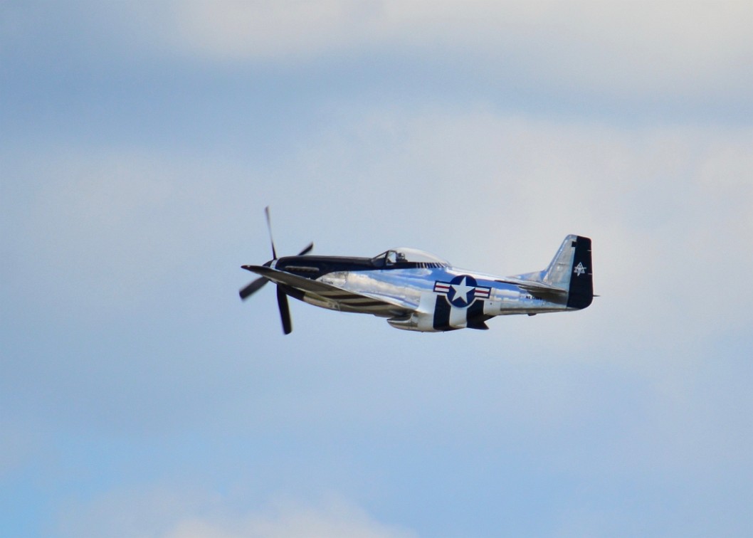 P-51D Mustang Against Distance Clouds