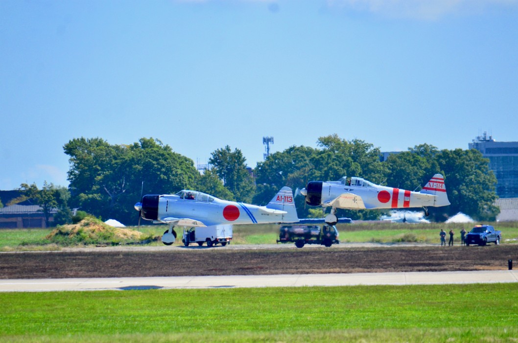 Two Mitsubishi A6M Zeros in Flight