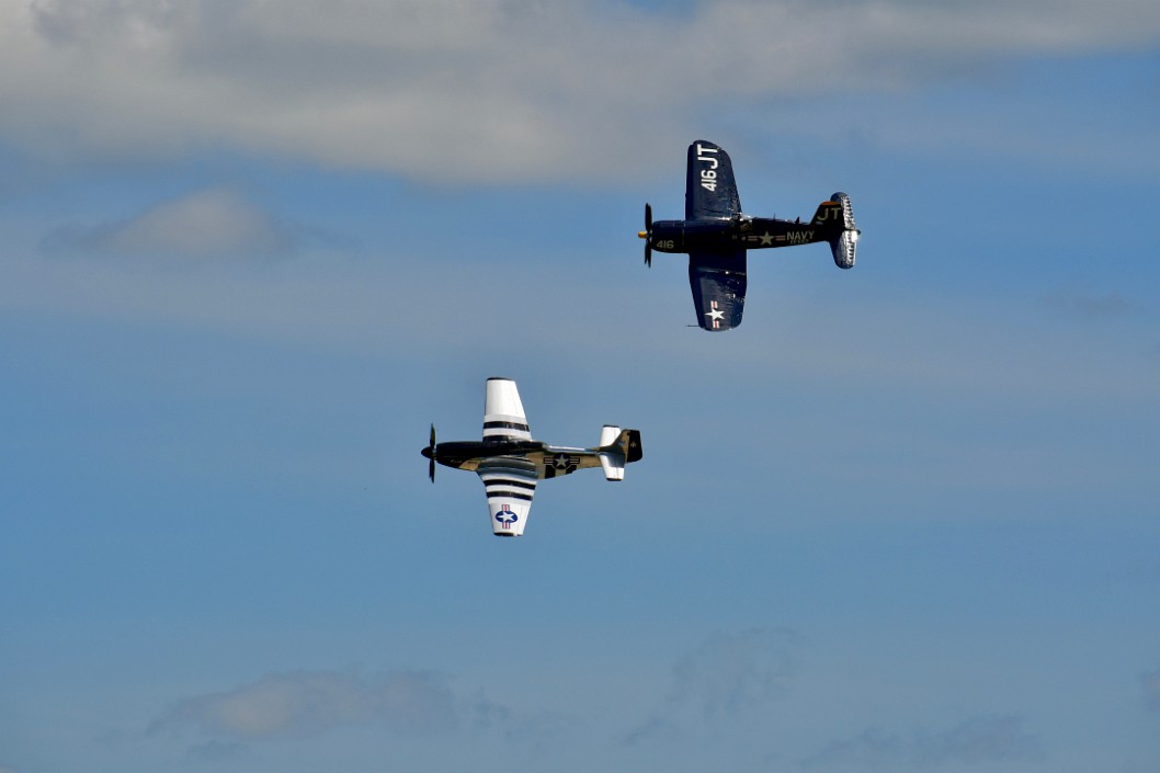 Mustang and Corsair in Flight