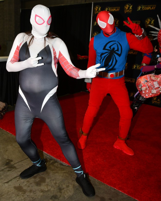 Spider-Gwen and Spider-Man Throwing a Peace Sign